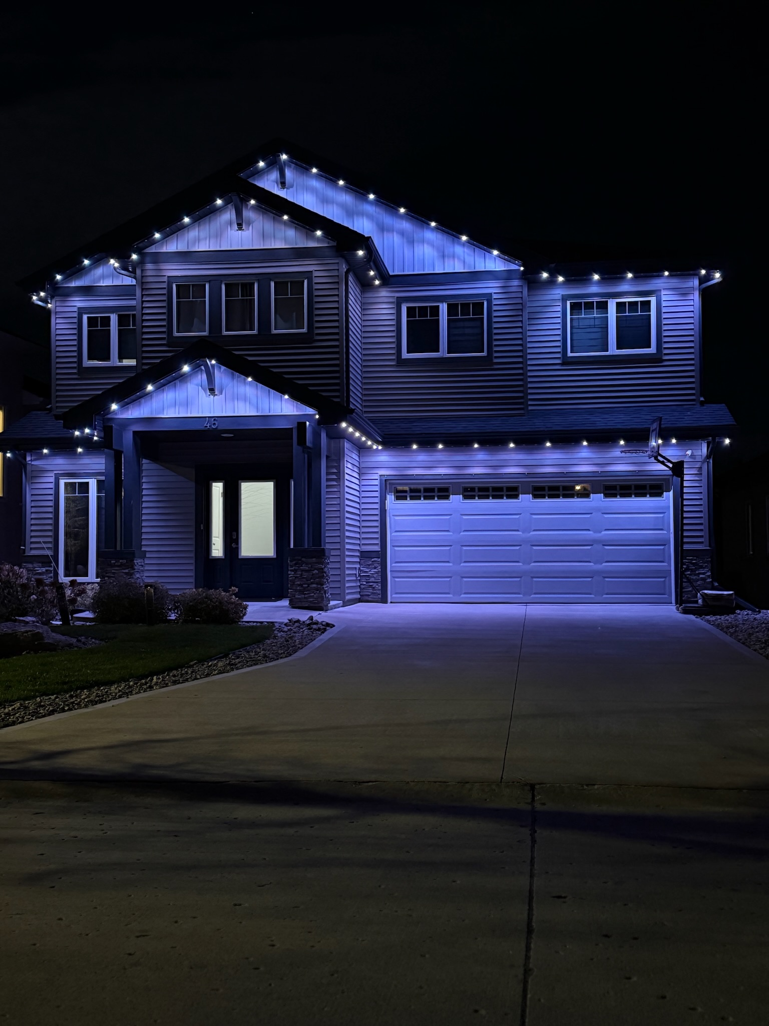 Blue LED lighting on two storey Winnipeg home