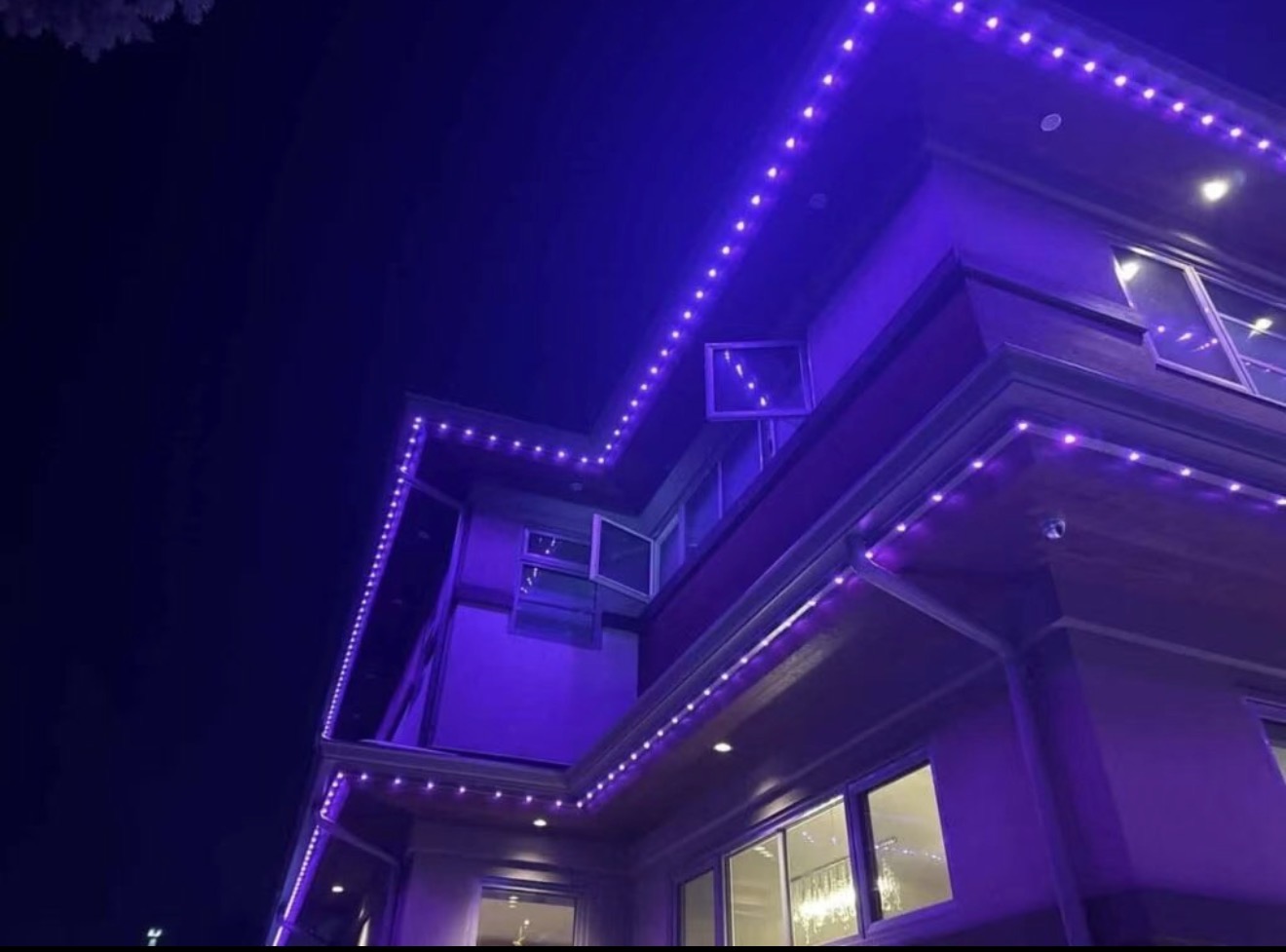 Purple LED lighting luxury home roofline